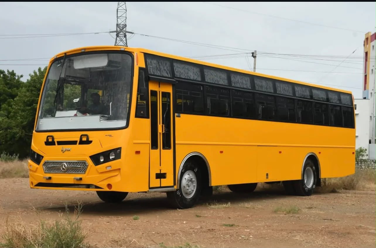 Yellow school bus body built by Alfha Coach Builders, Karur — Alfha Lynx model with steel-framed windows